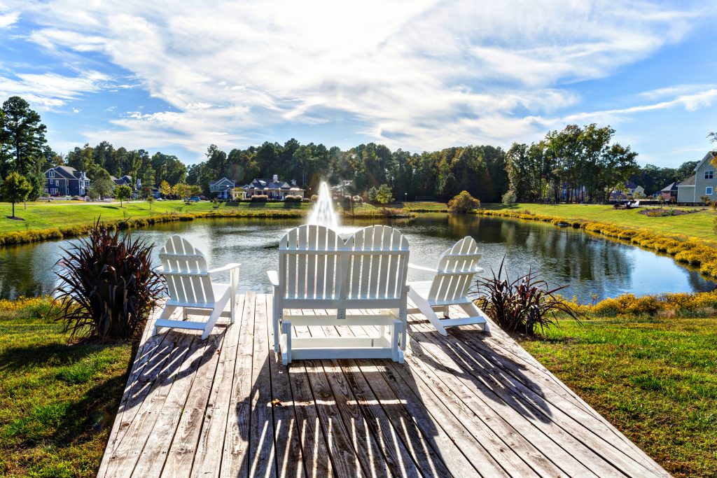 Chairs overlooking lake and fountain